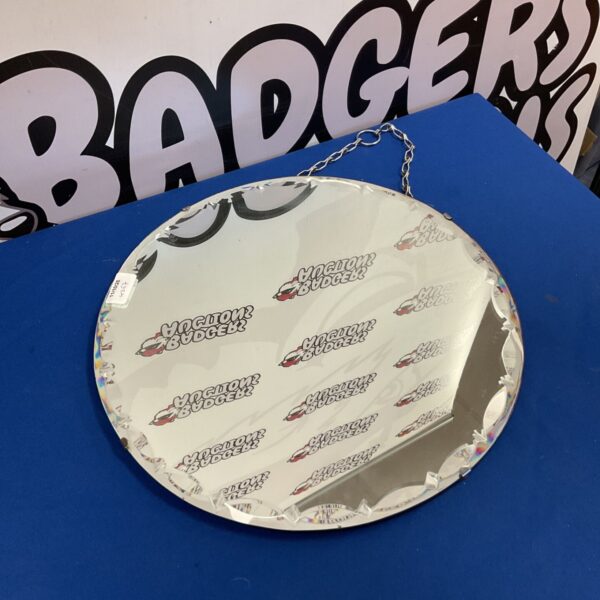 Vintage bevelled wall mirror with a classic mid-century design.
