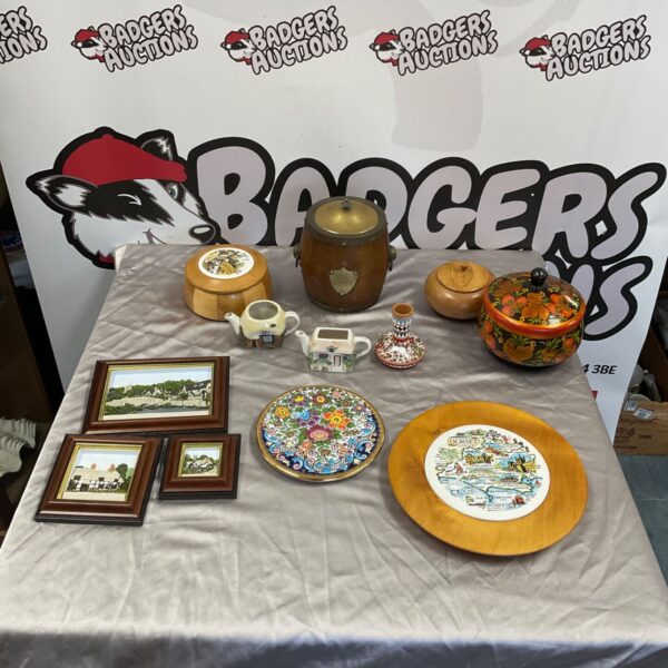 Vintage biscuit barrel with mixed decorative lot on display table