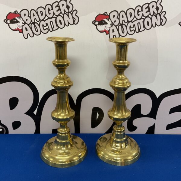 Pair of large vintage brass candlesticks with ornate detailing.