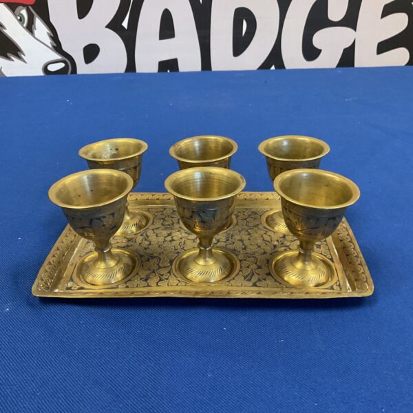 Vintage brass cups and tray with floral engraving, a collectible set.
