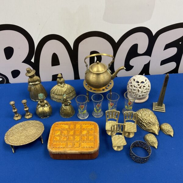 Mixed lot of vintage brassware with bells, hedgehogs and miniature candlesticks