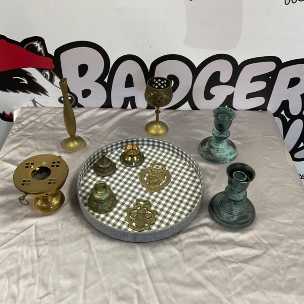 Tray of vintage brassware with candlesticks, bells and horse brasses