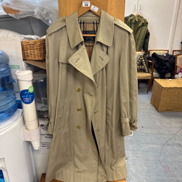 Vintage Burberry's full length trench coat with belted cuffs and gilt-tone buttons on a hanger