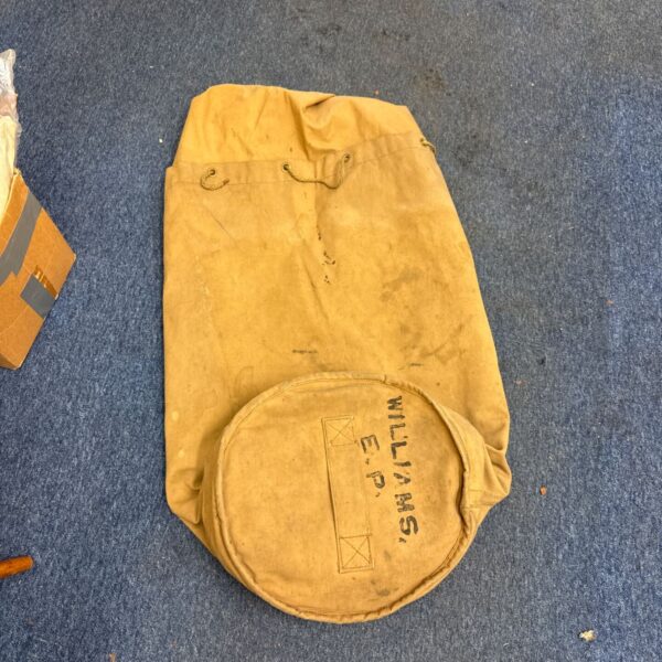 Vintage tan canvas naval kit bag with drawstring top and stencilled name