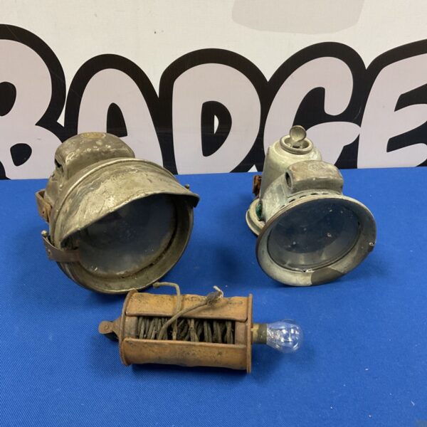 Group of vintage car lights, including P&H Powell Chalmers lamps.