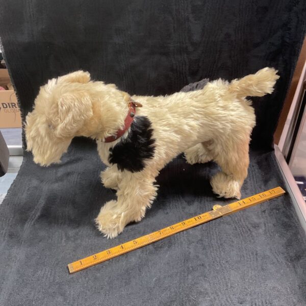 Vintage plush toy fox terrier with cream and black coat and red collar