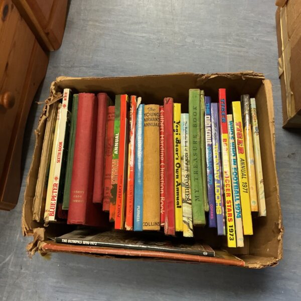 Cardboard box of vintage children's annuals including Tiger and Blue Peter titles