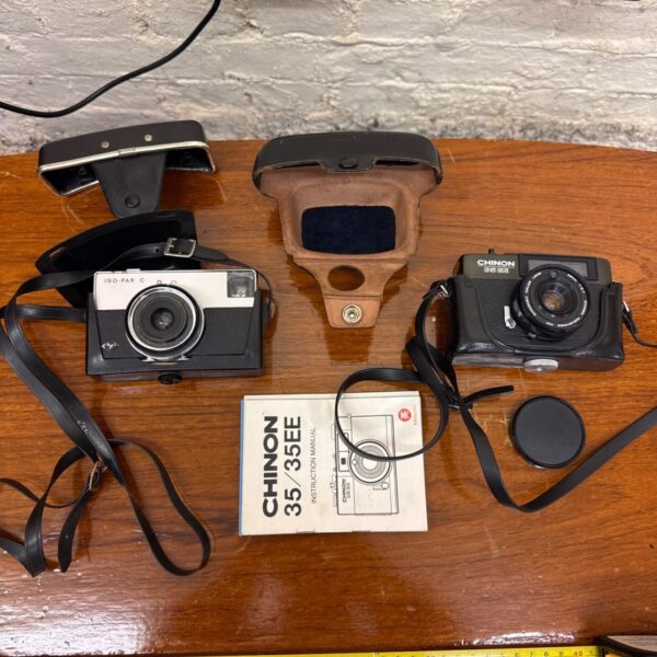 Vintage Chinon 35EE camera and Agfa ISO-PAK C camera with instruction manual