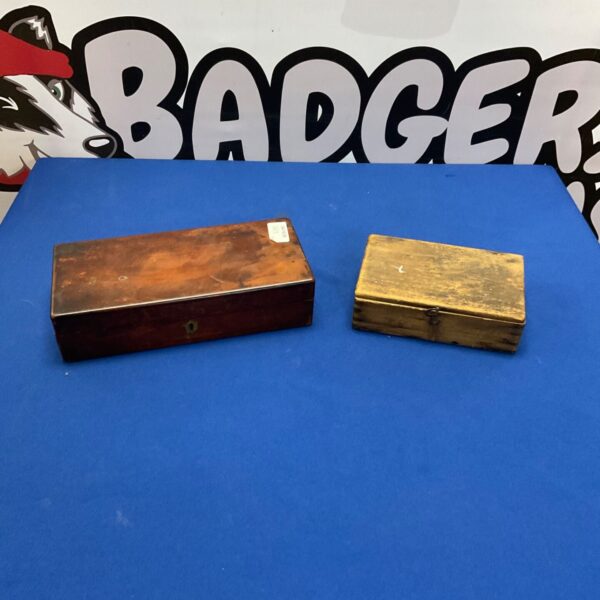 Pair of vintage wooden cigar boxes with aged patina.