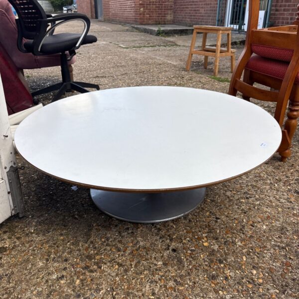 Vintage circle coffee table with dark finish and pedestal base.