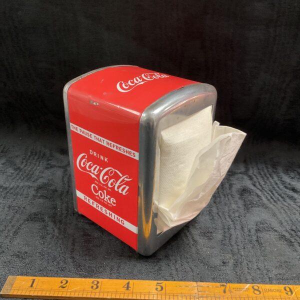 Vintage red Coca-Cola tinplate napkin dispenser with chrome-effect rim and napkins