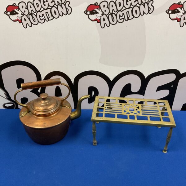 Vintage copper kettle with brass trivet, antique kitchenware.