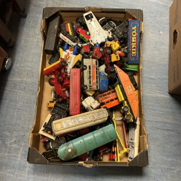 Vintage Corgi diecast models in a box, collectible toy cars.