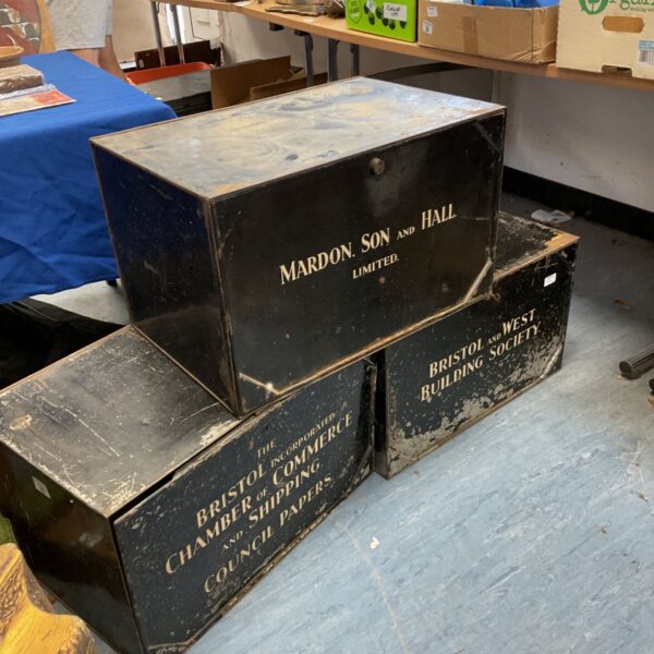 Vintage metal deed chests including Bristol & West Building Society box.