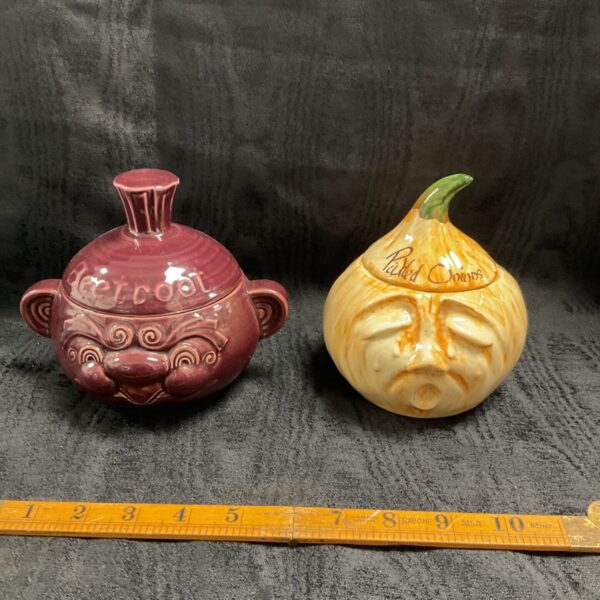 Two vintage facepots, maroon beetroot pot and cream pickled onion pot with lids
