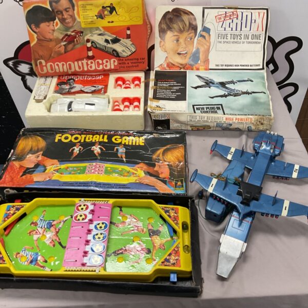 Vintage games lot featuring Computacar, Ford GT40, and ZeroX spaceship.