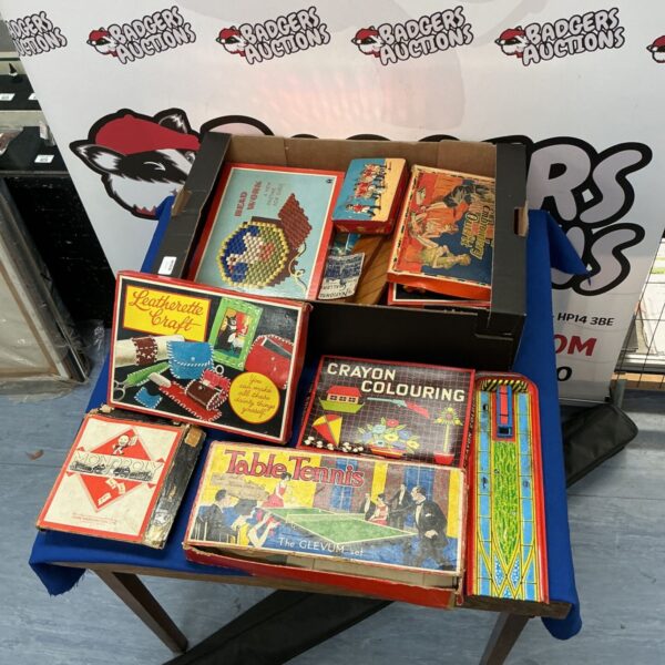 Vintage games lot featuring Monopoly and Table Tennis.