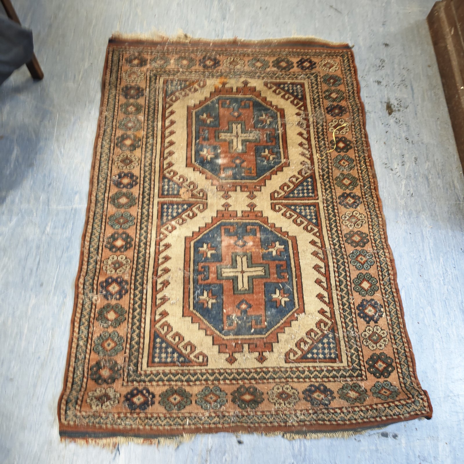 Vintage geometric pattern rug with two octagonal medallions on cream field