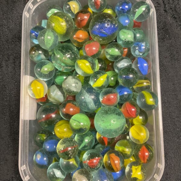 Tub of vintage glass marbles in green, blue, yellow and red swirls