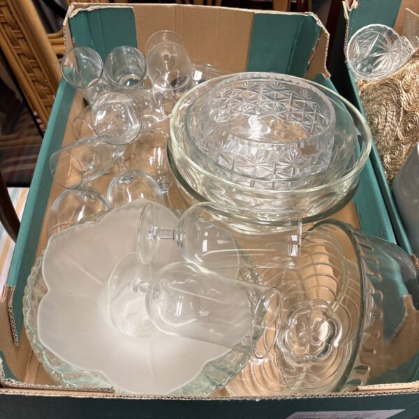Vintage etched glassware collection including glasses and bowls.