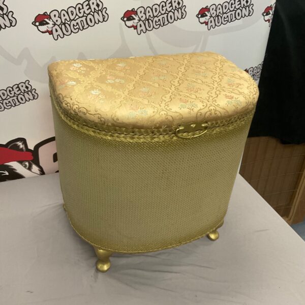 Vintage gold laundry basket in Lloyd Loom style for storage.