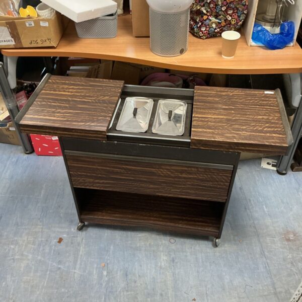 Vintage hostess trolley with two tiers and wooden frame.