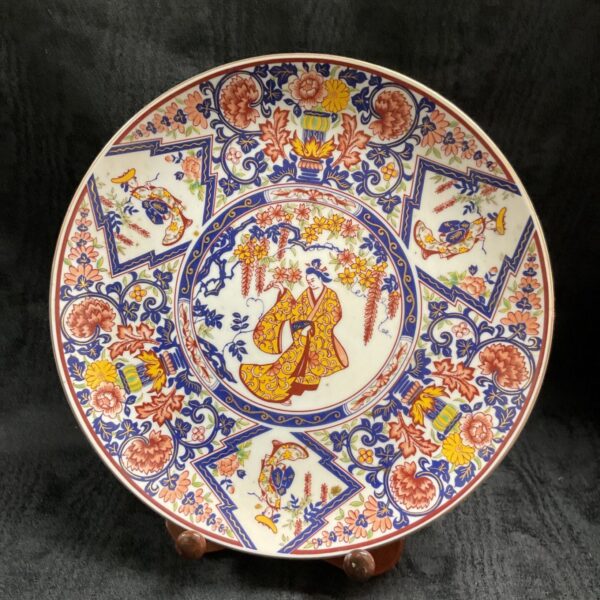 Vintage Imari plate with hand-painted floral design.