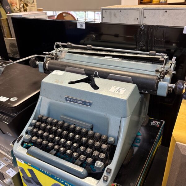 Light blue vintage Imperial 70 manual typewriter with black keys