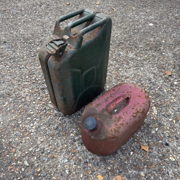 Green vintage Jerry can, metal fuel container.