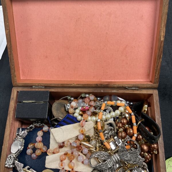 Vintage jewellery collection including necklaces, brooches and bracelets.
