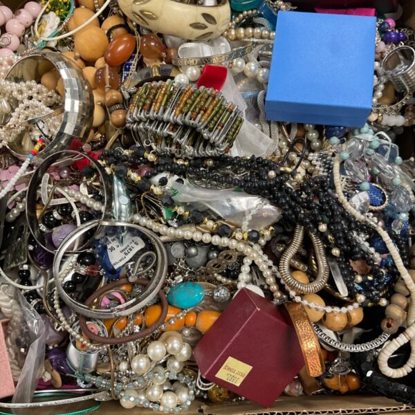 Large mixed lot of vintage necklaces, bracelets and bangles in a cardboard box