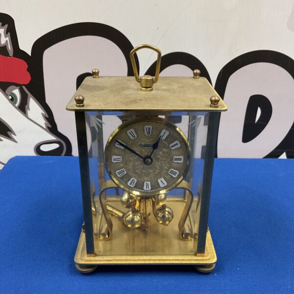 Front view of vintage Kern brass and bevelled glass anniversary clock