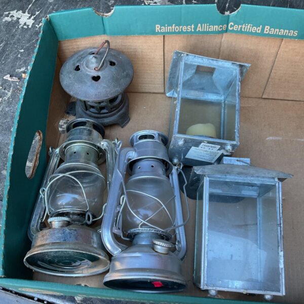 Vintage hurricane lamp and candle lanterns, antique lighting collection.