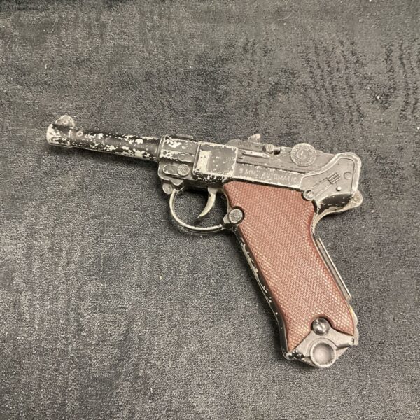 Vintage Lone Star automatic cap gun with black finish and brown chequered grips