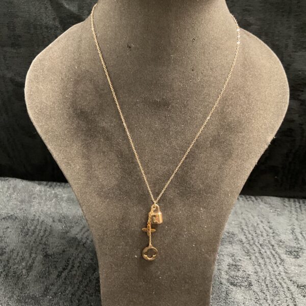 Vintage Louis Vuitton style lock charm necklace with gold tone chain and pendants