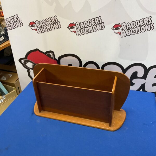 Vintage mahogany magazine rack for holding magazines and books.