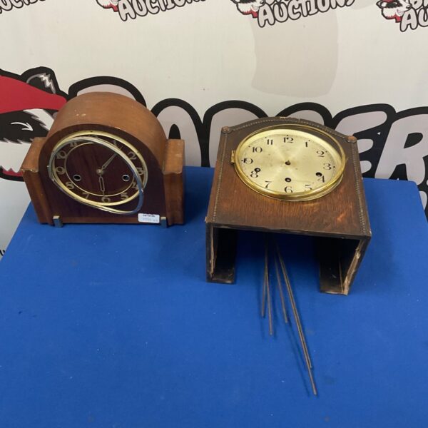 Vintage mantel clock with a circular dial, ideal for restoration.
