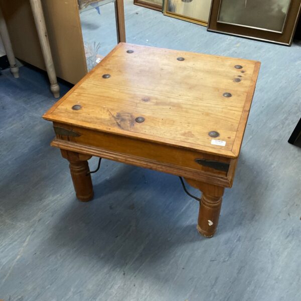 Vintage Mexican coffee table with rustic wood finish.