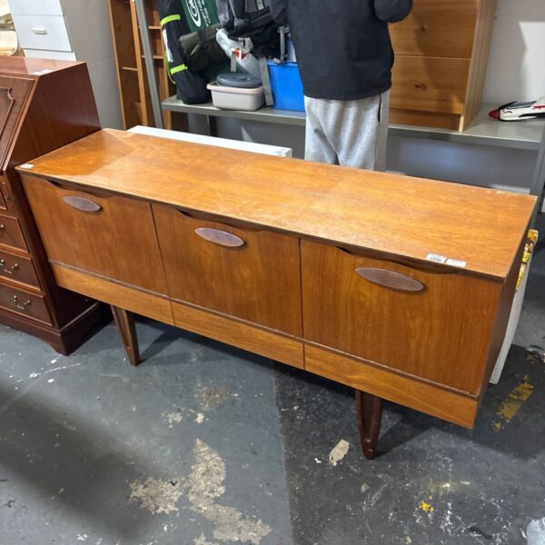 Vintage mid-century modern teak sideboard with three cupboard doors and tapered legs