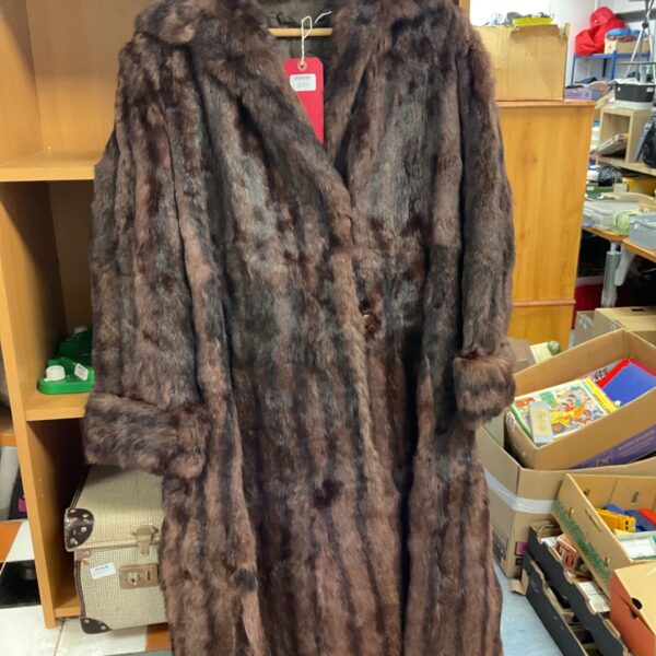Vintage mink fur coat in mottled brown fur on a wooden hanger
