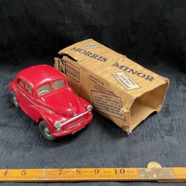 Vintage red V Models Morris Minor tinplate toy car with original box.