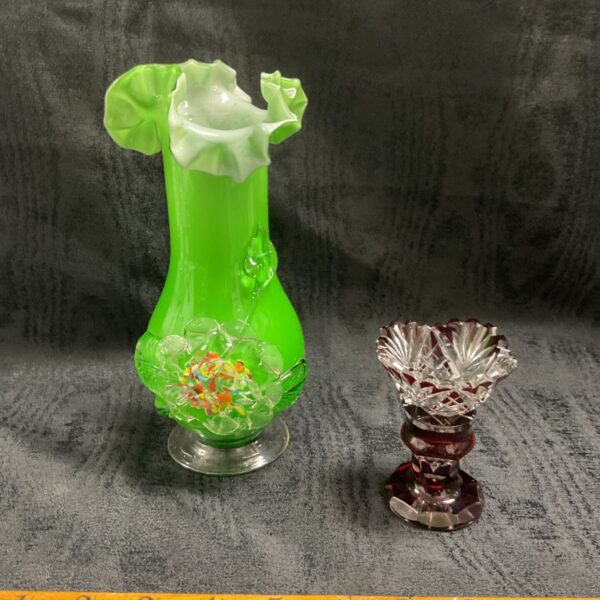 Vintage green hand blown Murano-style glass vase beside small ruby cut glass vase