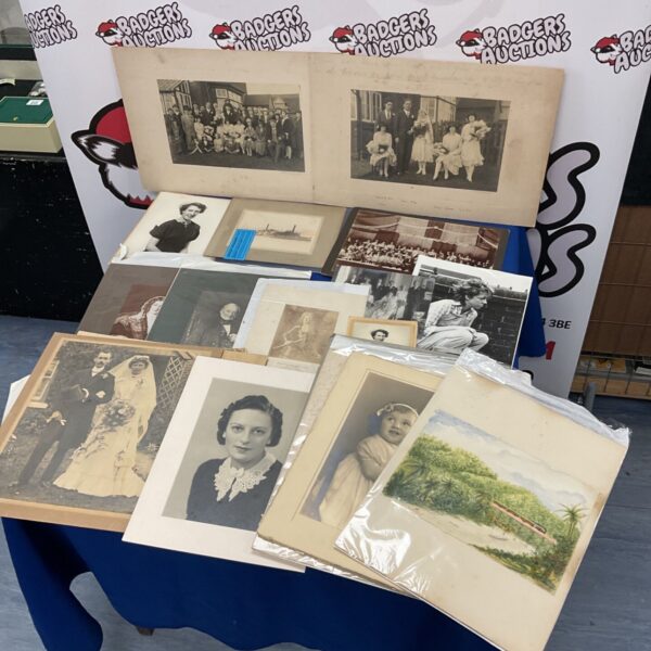 Vintage photograph collection featuring antique portraits and prints.