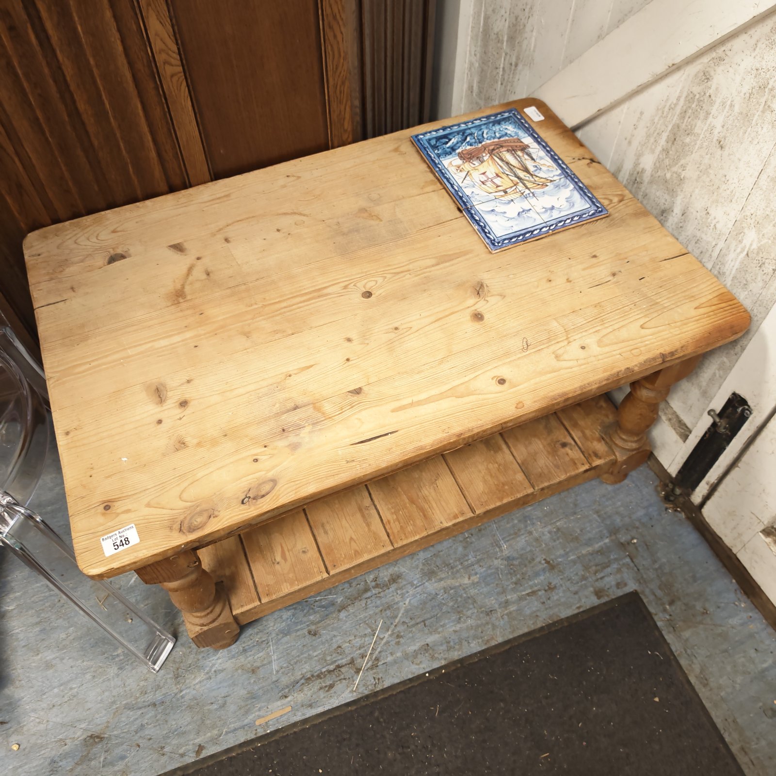 Vintage pine coffee table with a detailed galleon tile insert.