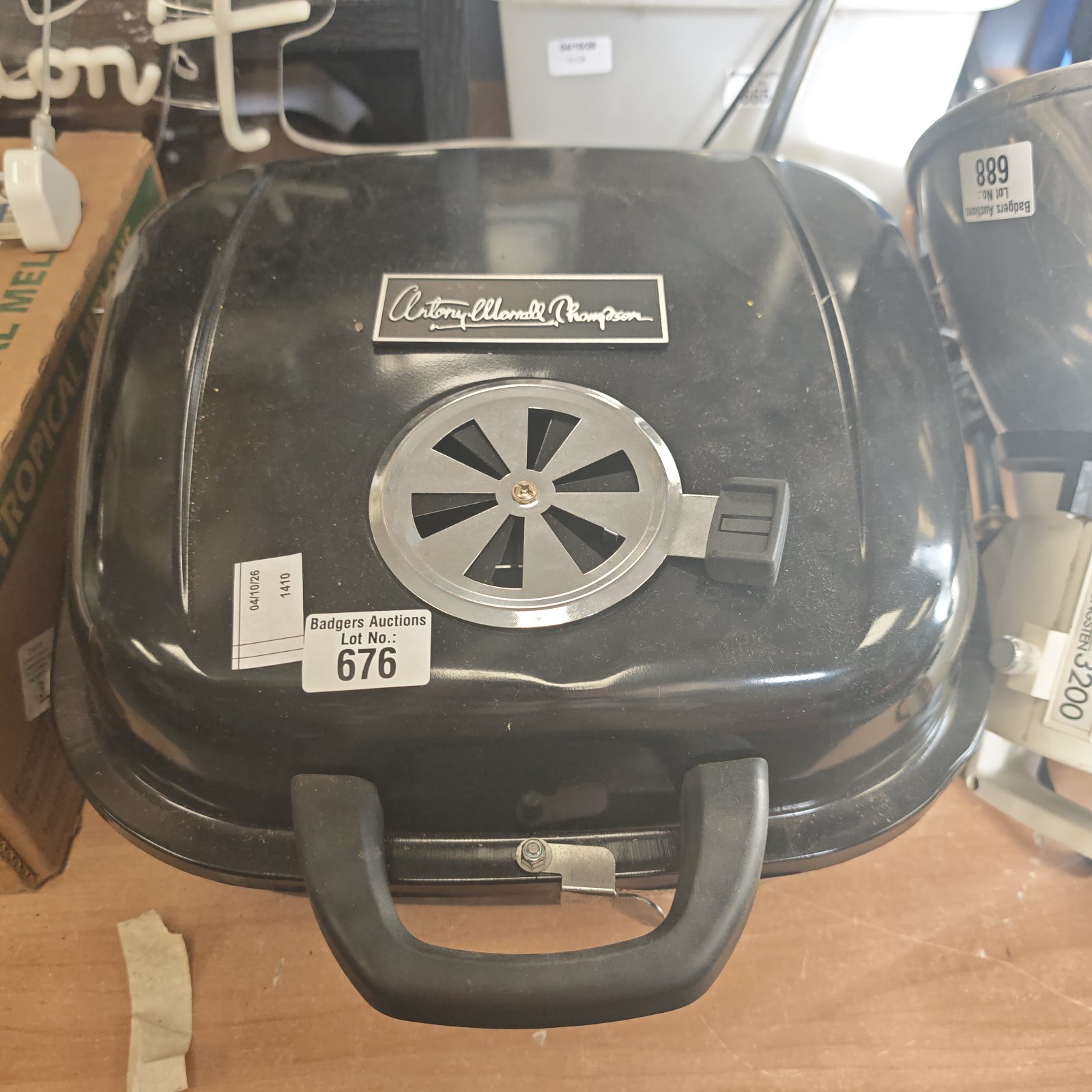 Vintage portable BBQ grill, black metal tabletop barbecue.