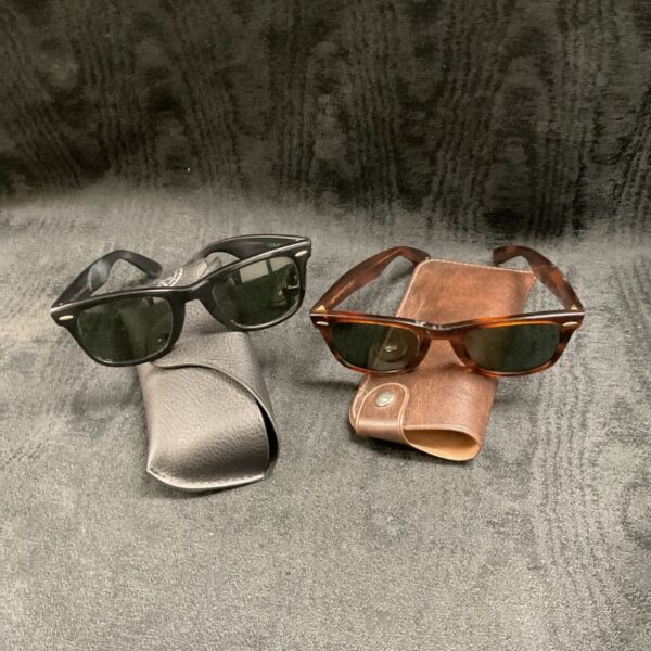 Vintage Ray-Ban Wayfarer sunglasses pair with cases.