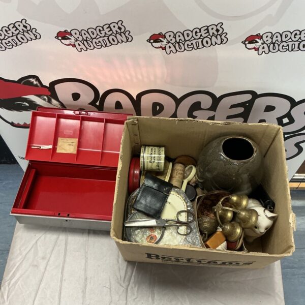 Red metal cash box beside mixed lot with vase and brass bells