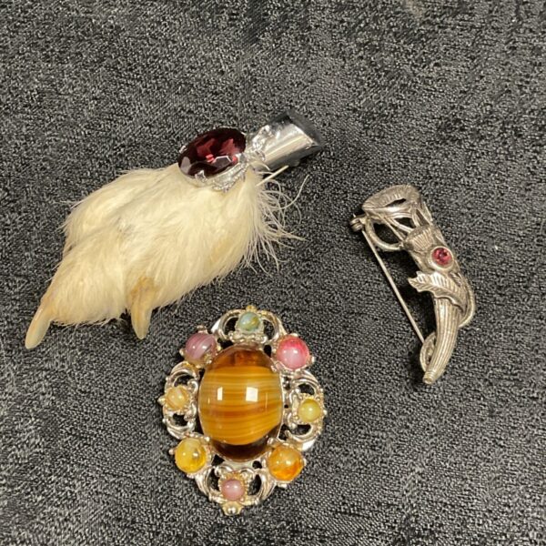 Vintage Scottish brooch with amber stone and silver setting.