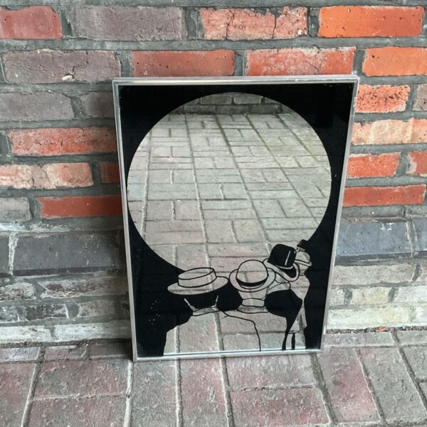 Vintage silhouette mirror with hat designs, mid-century modern style.