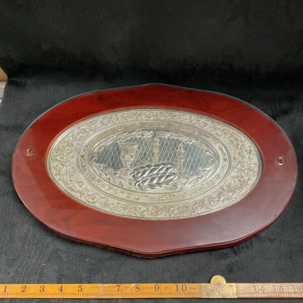 Vintage silver challah tray with embossed decoration and glass top.